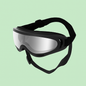 Gafas protectoras negras para perros con lentes efecto espejo sobre fondo verde Petify